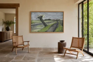 Kehystetty jäljennös Van Goghin teoksesta Pollard Willow seinällä kalustetussa huoneessa